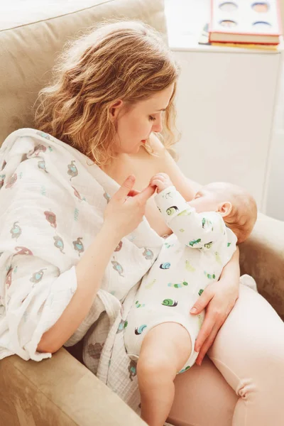 Mother holding breastfeeding baby — Stock Photo, Image