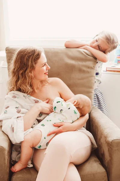 Mother breastfeeding newborn baby Royalty Free Stock Images