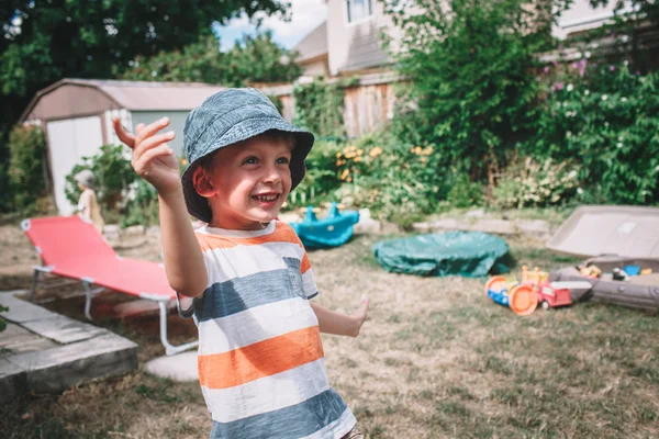 Boy wearing stripped shirt and hat — Stock Photo, Image