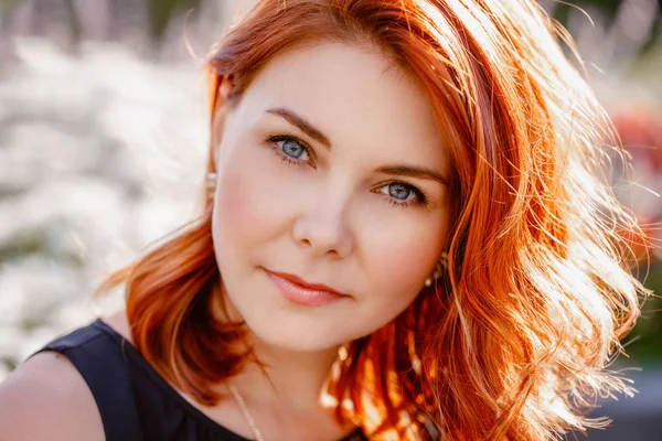 Woman with waved curly red hair — Stock Photo, Image