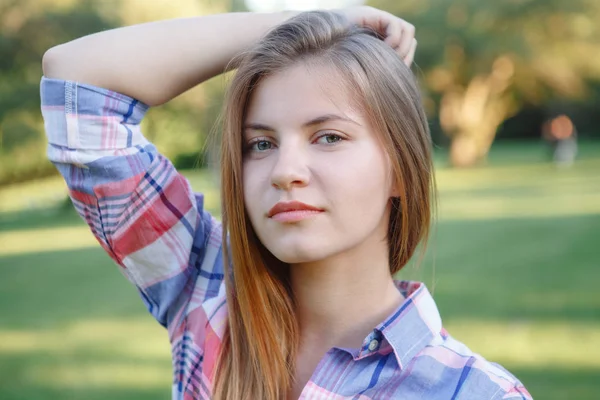 Beautiful woman in plaid shirt — Stock Photo, Image