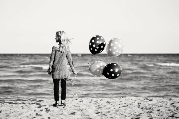 Child with bunch of balloons — Stock Photo, Image