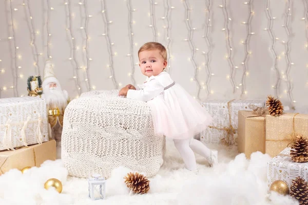 Portrait of blonde Caucasian baby girl with blue eyes looking in camera celebrate Christmas or New Year holiday — Stok Foto
