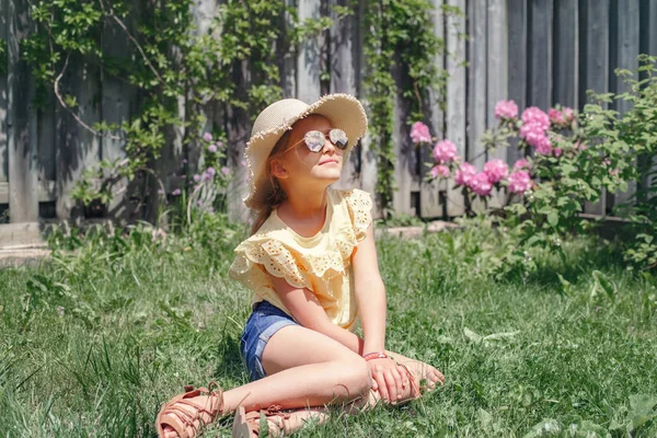 Portrait Cute Adorable Child Girl Sunglasses Straw Hat Sitting Grass — Stock Photo, Image