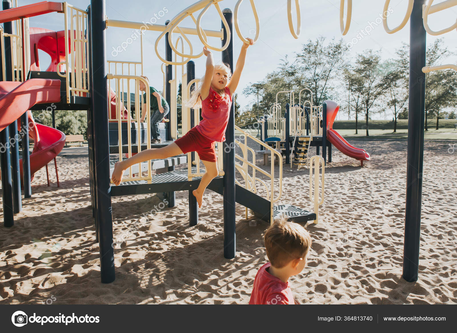 Young Caucasian Girl Hanging Monkey Bars Park Playground Summer Outdoor