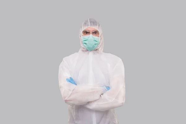 Male Laboratory Worker Wearing Medical Mask, Gloves and Chemical Suit. Man Hands Crossed anti Virus. Medical Concept