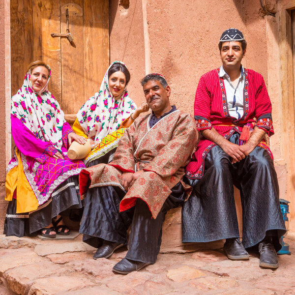 Family in traditional clothes in Abyaneh, Iran