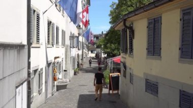ZURICH, SWITZERLAND - JULY 04, 2017: Citizens and tourists walking on the streets of Zurich, Switzerland. Zurich is a leading global city and among the world's largest financial center.