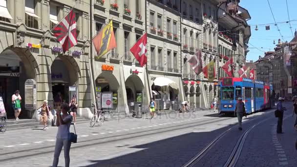 BERN, SWITZERLAND - JULY 06, 2017: Colorful trams at Kramgasse in Bern, Switzerland. Kramgasse is part of the World Cultural Heritage of UNESCO. — Stock Video