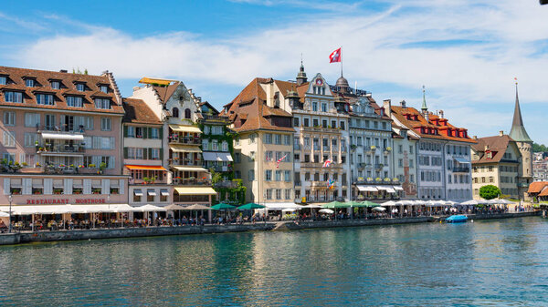 LUCERNE, SWITZERLAND - JULY 04, 2017: View of historic Lucerne city center, Switzerland. Lucerne is the most populous town in Central Switzerland, and a nexus of economics, transportation, culture, and media of this region.