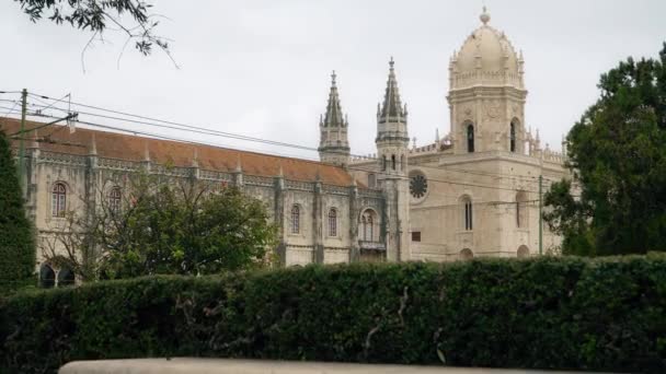 LISBON, circa 2018: Tourist bus at Jeronimos Monastery or Hieronymites Monastery. Lisbon is continental Europes westernmost capital city and the only one along the Atlantic coast. — Stock Video