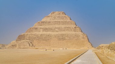 The Pyramid of Djoser or Djeser and Zoser , or Step Pyramid is an archaeological remain in the Saqqara necropolis, Egypt, northwest of the city of Memphis. The 6-tier, 4-sided structure is the earliest colossal stone building in Egypt. It was built i clipart