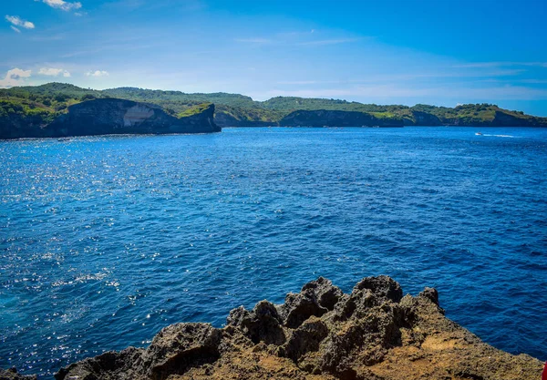 Beautiful Angel\'s Billabong view. Sharp dramatic rocks and crashing waves at the entrance to Angel\'s Billabong on Nusa Penida, wonderful Angels Billabong at Nusa Penida, Bali Indonesia, Angel\'s Billabong is natural infinity pool on the island