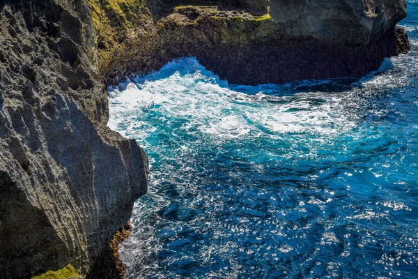 Beautiful Angel\'s Billabong view. Sharp dramatic rocks and crashing waves at the entrance to Angel\'s Billabong on Nusa Penida, wonderful Angels Billabong at Nusa Penida, Bali Indonesia, Angel\'s Billabong is natural infinity pool on the island
