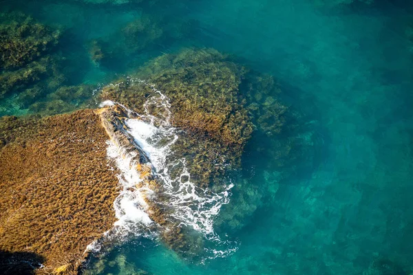 Aerial view of ocean waves and fantastic Rocky coast. The concept of calmness silence and unity with nature