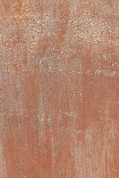 Painted rusty metal surface for background. Red painted metal with rust.