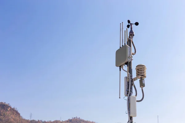 Communication towers and weather monitoring equipment at Srinakarin Dam, Kanchanaburi Province, Thailand
