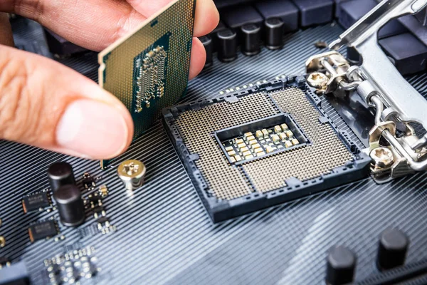 Closeup Detail Cpu Chip Socket Hand Modern Computer Black Motherboard — Stock Photo, Image