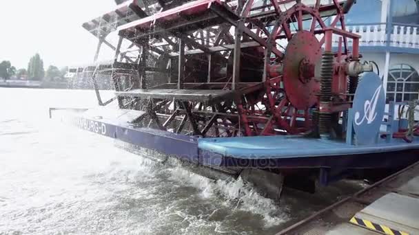 Spinning paddle wheel on back side of boat — Stock Video