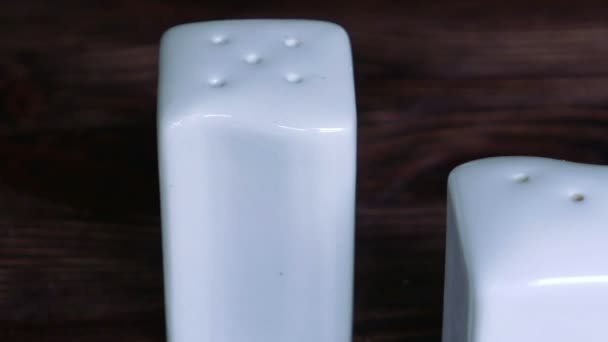 Pair of white salt and pepper pots — Stock Video