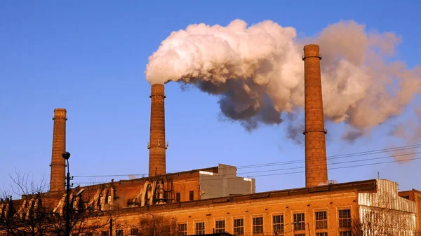 Factory plant smoke stack over blue sky background — Stock Photo, Image