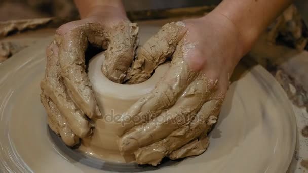 Potter is making clay pot on the potters wheel — Stock Video