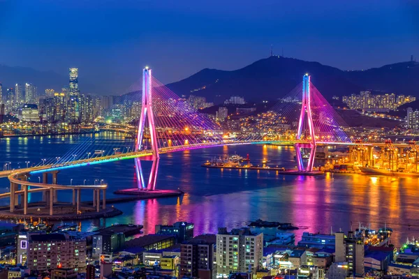Busan harbor bridge lits up at night in different colors. Taken in Busan, South Korea
