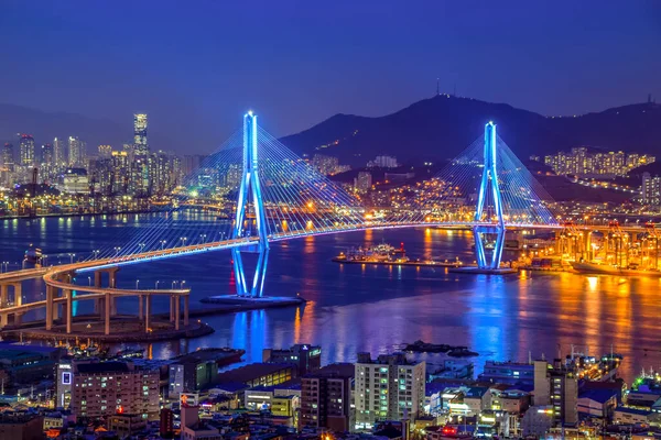 Busan harbor bridge lits up at night in different colors. Taken in Busan, South Korea