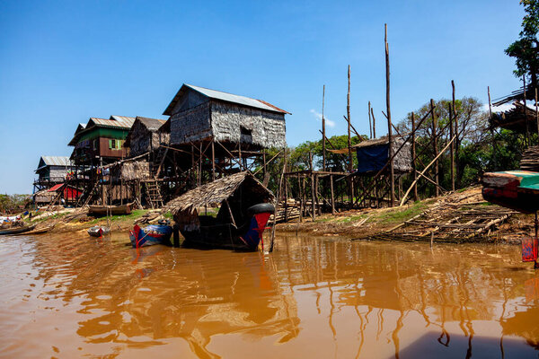 Tonle SAP, Cambodia - February 2014: Kampong Phluk village during drought season. Life and work of residents of Cambodian village on water, near Siem Reap, Cambodia