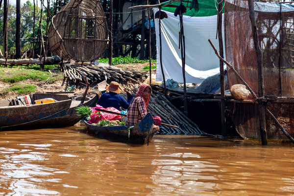 Tonle SAP, Cambodia - February 2014: Kampong Phluk village during drought season. Life and work of residents of Cambodian village on water, near Siem Reap, Cambodia