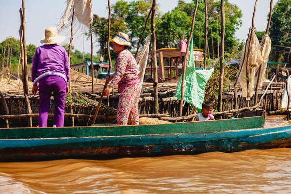 Tonle SAP, Cambodia - February 2014: Kampong Phluk village during drought season. Life and work of residents of Cambodian village on water, near Siem Reap, Cambodia