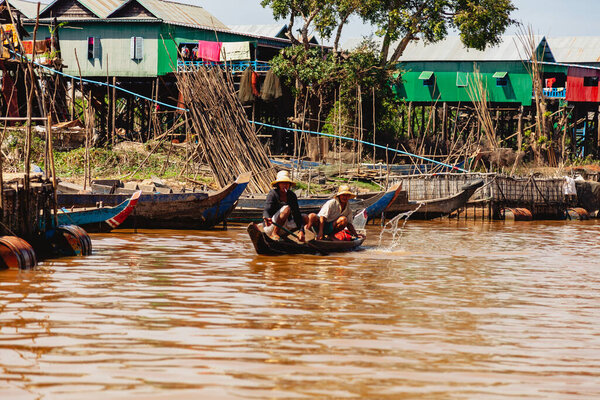 Tonle SAP, Cambodia - February 2014: Kampong Phluk village during drought season. Life and work of residents of Cambodian village on water, near Siem Reap, Cambodia