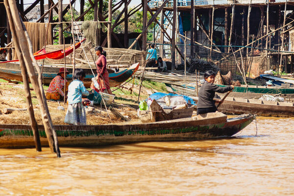 Tonle SAP, Cambodia - February 2014: Kampong Phluk village during drought season. Life and work of residents of Cambodian village on water, near Siem Reap, Cambodia