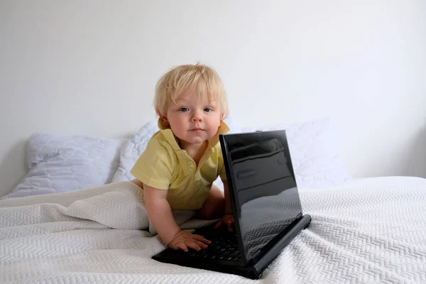 Little Boy Laptop Bed Royalty Free Stock Photos