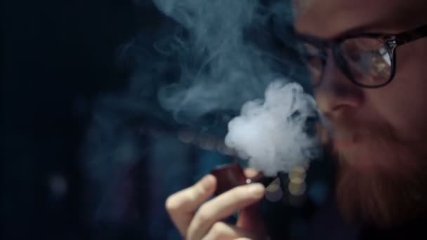 Portrait of man smoking pipe — Stock Video