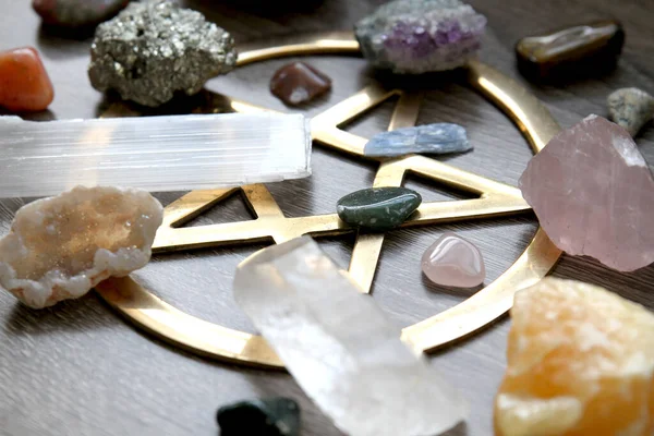 Crystals and stones with gold pentagram