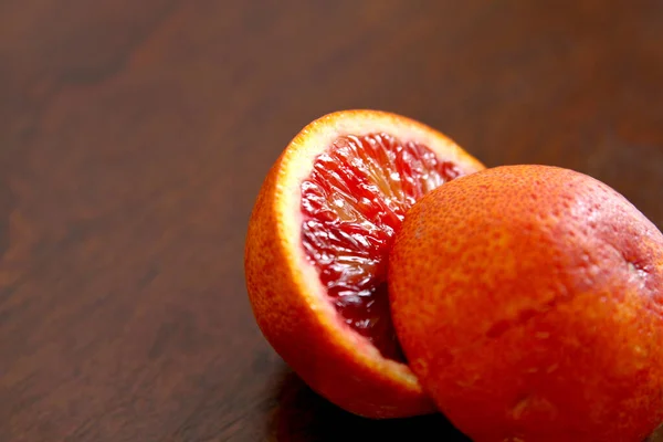 A blood orange cut in two halves