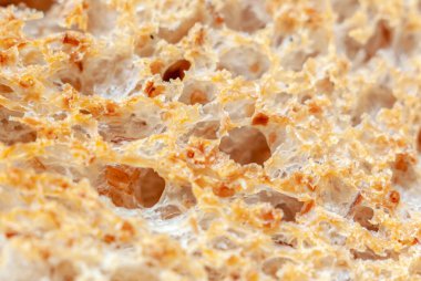 Taze buğday ekmeğinin dokusunun Macro fotoğrafı, biraz kızarmış.