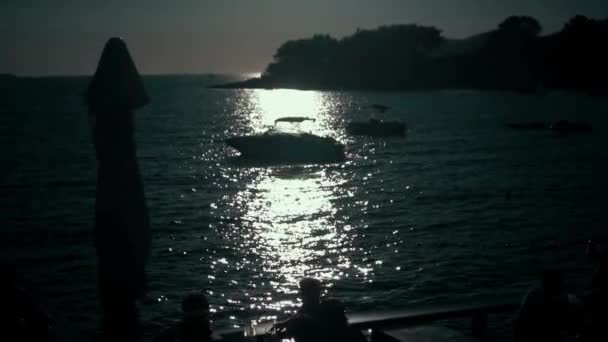 A silhouette of motor boat at sunset — Stock Video