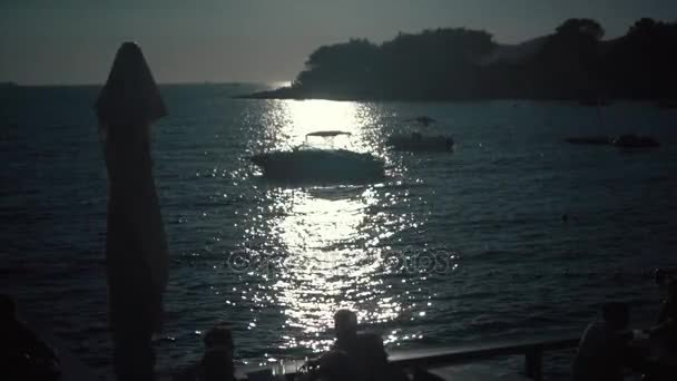 A silhouette of motor boat at sunset — Stock Video