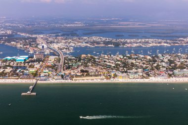 Fishing Pier Fort Myers Beach. Aerial view to the large white sandy beach on the Estero Island, Florida clipart