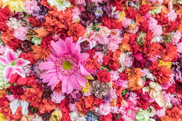 Floral colored background. Many flowers arranged in the substrate. The concept of color, structure flowers. Beautiful flowers background for wedding scene