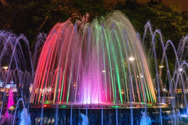 Colored fountain at might in circle inn Hai Phong, Vietnam