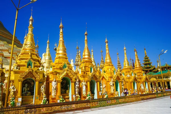 Amazing golden temples near Shwedagon Pagoda in Yangon. The most important buddhists pagoda in Myanmar.