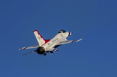 Airplane Air Force Thunderbirds F-16 jet fighter performing at the 2016 Huntington Beach Air Show in California clipart