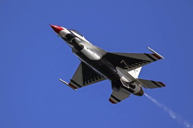 Airplane Thunderbirds F-16 fighter jet flying at 2016 Huntington Beach Air Show clipart