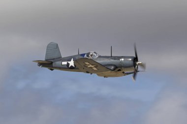 Airplane WWII vintage F4U Corsair fighter flying at 2017 Los Angeles Air Show clipart