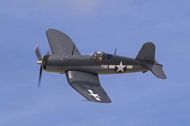 Airplane WWII vintage F4U Corsair fighter flying at 2017 Los Angeles Air Show clipart