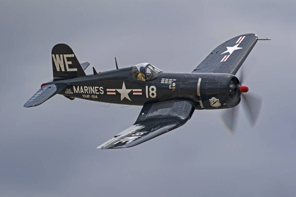 Airplanes WWII F4-U Corsair fighter aircraft flying at California Air Show