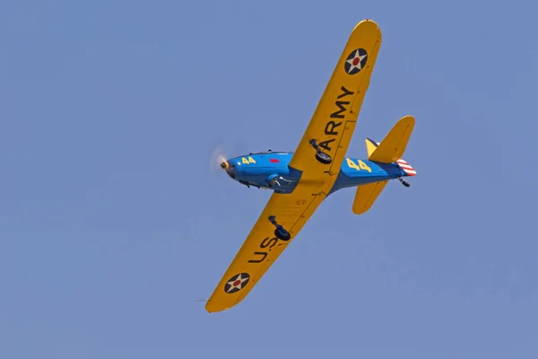 Airplane PT-19 WWII fighter trainer aircraft flying at the airshow Stock Image
